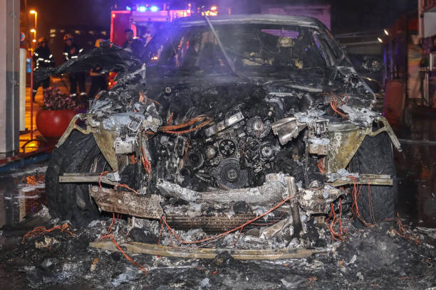 istock burned car on street at night 1292769448