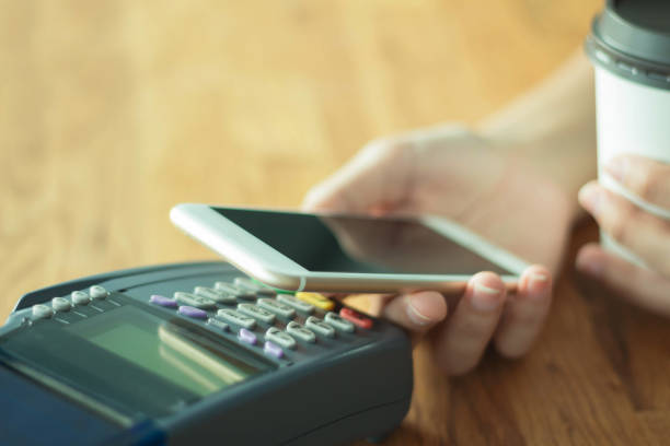 istock Mobile Payment with NFC technology phone shopping online 1292769733