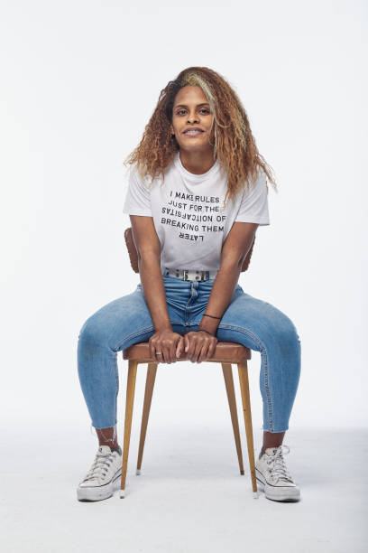 istock Young woman sitting on chair 1292771390