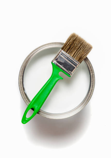 istock new green construction brush on a can of paint on a white background 1292771401