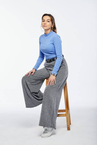 istock Young woman sitting on chair 1292771528