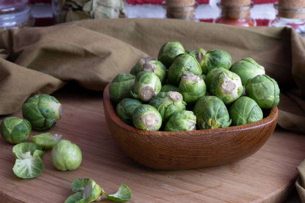 istock Brussels sprouts lie in a wooden bowl on the table 1292772281