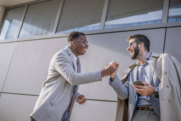 istock Two businessmen greeting each other 1292772444