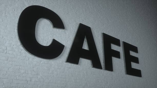 istock The black CAFE text is put on the white brick wall. 3d rendering 1292772610