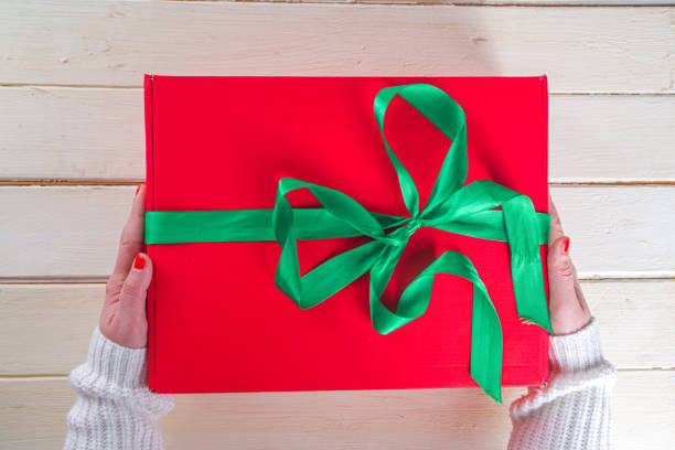 istock Big Christmas Gift in Woman Hands 1292775591
