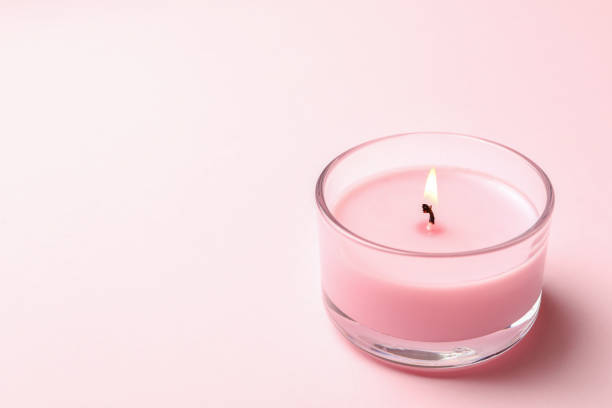 istock Scented candle for relax on pink background 1292775722