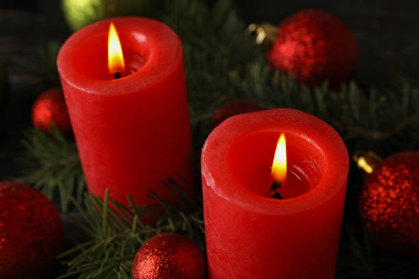 istock Red candles, baubles and pine branches, close up 1292775806
