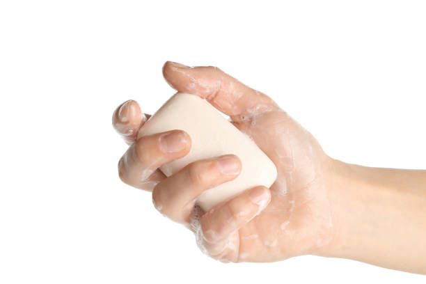 istock Female hand with soap and foam isolated on white background 1292776909