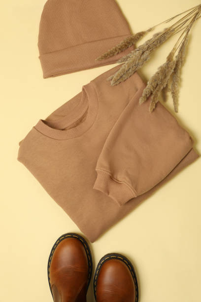 istock Stylish autumn wear on beige background, top view 1292777393