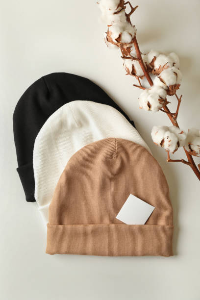 istock Stylish beanies and cotton on white background 1292777599