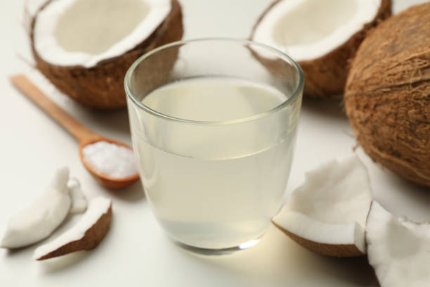 istock Fresh coconut and coconut milk on white background 1292778596