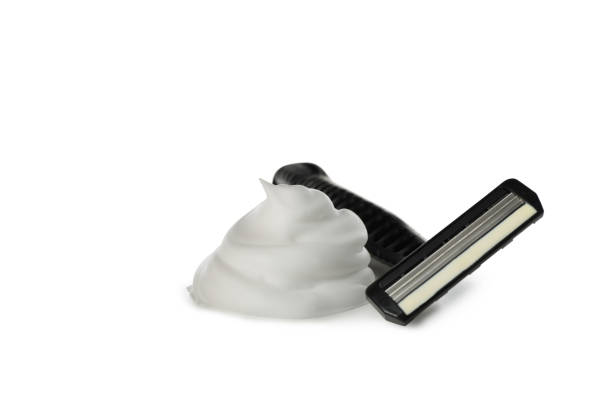 istock Shaving foam and razor isolated on white background 1292779537