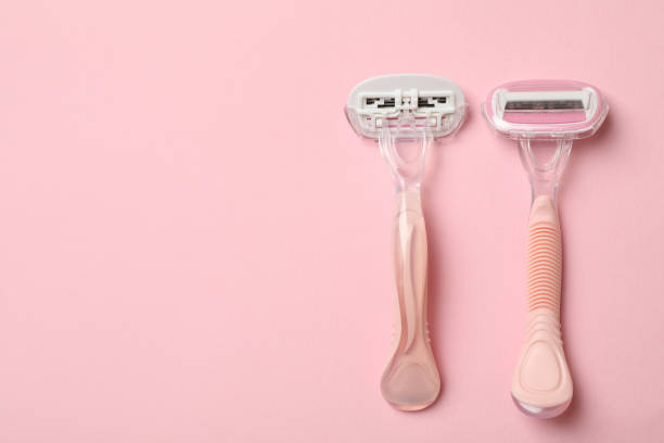 istock Two razors on pink background, space for text 1292779818
