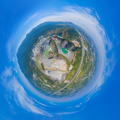 Little planet 360 degree sphere. Panorama of aerial view of machine excavator trucks dig coal mining or ore in quarry in factory industry. Environment resources.