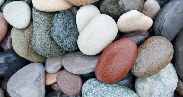 istock abstract background with round wet pebble stones 1292781818