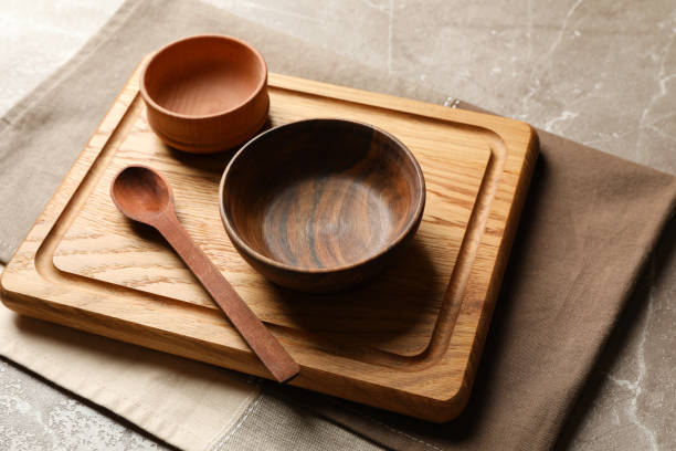 istock Towel with wooden kitchenware on gray table 1292781947