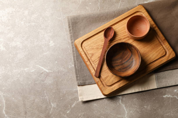 istock Towel with wooden kitchenware on gray table 1292781960