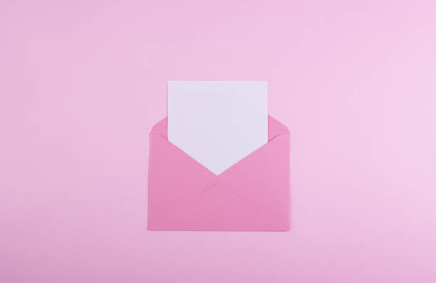 istock Envelope with a red heart for Valentine's Day on a pink background 1292784218