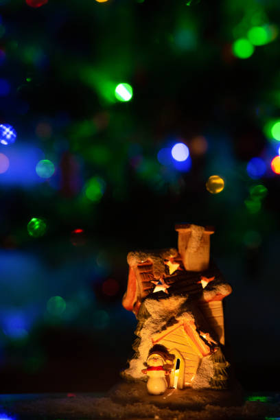 istock Christmas candlestick with a burning candle, snowman selective focus 1292784542
