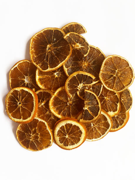 istock Dry slice of orange isolated on a white 1292785603