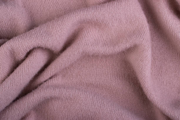 istock Crumpled twisted wool fabric close-up for background 1292785709