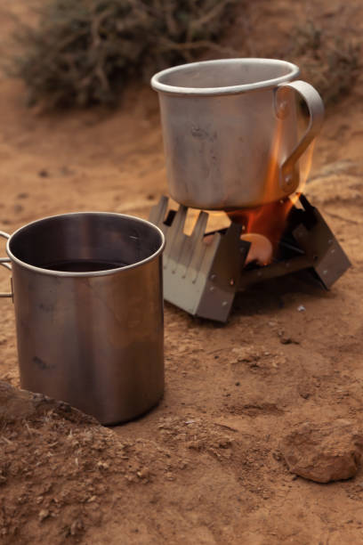 istock Iron, tourist mugs on an open fire during a camping trip 1292787074