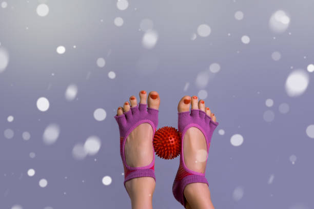 istock Female legs with small ball for trigger zones 1292789465