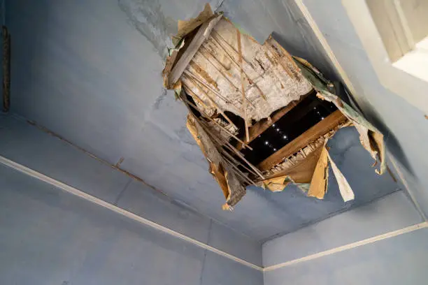 Collapsing ceiling in an abandoned home, in desperate need of repair