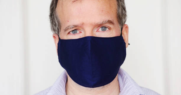 istock Sad mature man portrait behind protective mask 1292790785