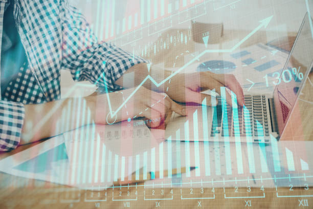 istock Multi exposure of stock market chart with man working on computer on background. Concept of financial analysis. 1292791871