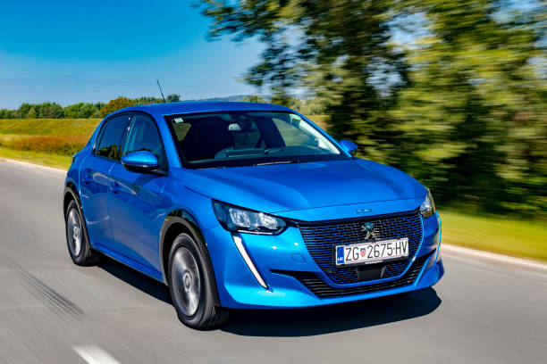 new peugeot e208 driving - speed horizontal commercial land vehicle automobile industry imagens e fotografias de stock