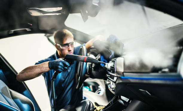 istock Car detailing service deep interior cleaning. 1292796067