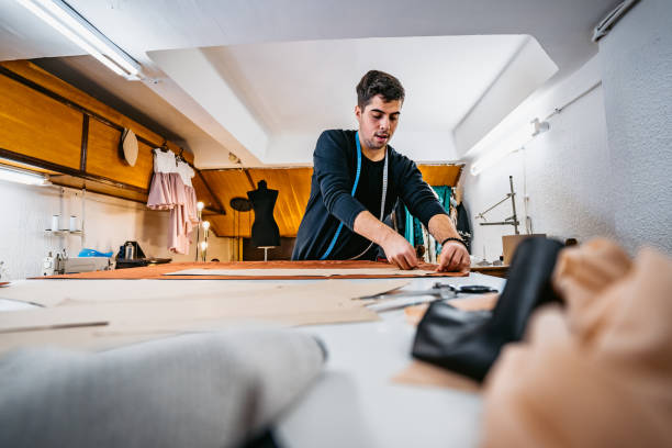 istock Fashion designer working in atelier 1292797106