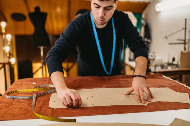 istock Fashion designer working in atelier 1292797151
