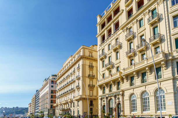 Grand Hotel Excelsior and ancient baroque style palaces on Partenope Street, The beautiful and famous seafront of Naples Naples, Italy October 2020: Grand Hotel Excelsior and ancient baroque style palaces on Partenope Street, The beautiful and famous seafront of Naples excelsior hotel photos stock pictures, royalty-free photos & images
