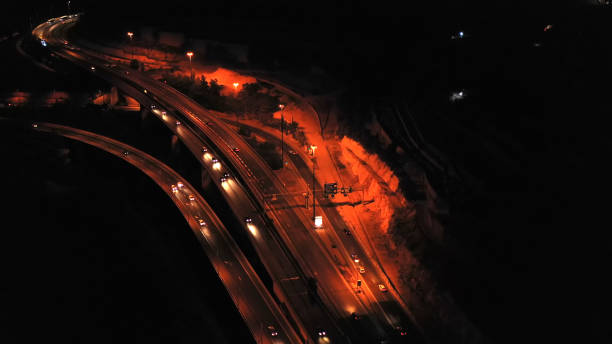 istock Highway with traffic at night aerial view 1292798875