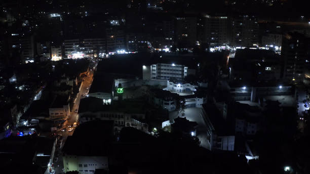 istock Palestinian Refugees Camp with mosque at night, Aerial view 1292798937