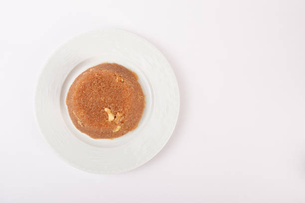 istock Semolina halva in a white plate on the white background 1292799050
