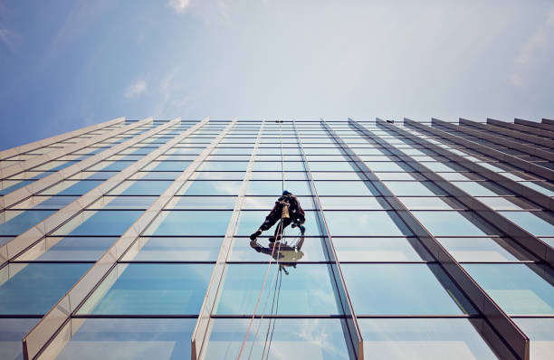Premium Photo  Window cleaning in high-rise buildings, houses