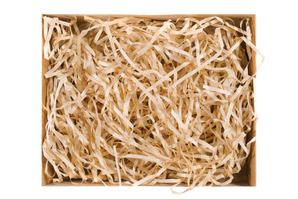 istock Open cardboard box and straw isolated on a white background. Secure delivery service. 1292801919