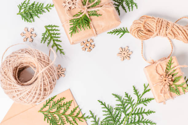 istock Christmas fir tree branches, gifts on white background. Copy space. Banner backdrop. Copy space. Christmas composition. 1292802022