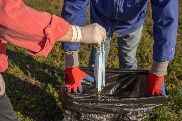 istock Volunteers picking up rubbish in nature 1292802974