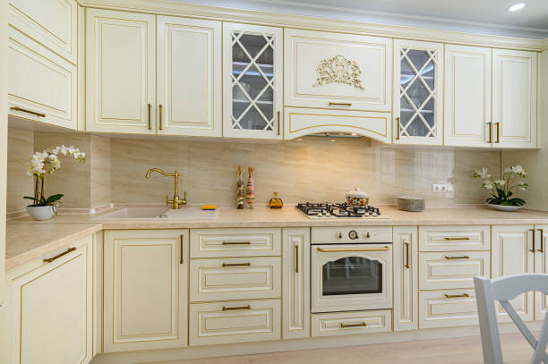 istock Beige furniture at kitchen in provence style, front view 1292804009