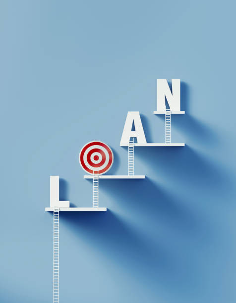 istock White Ladders Lean over A Bull's Eye Target and Write Loan on Blue Wall 1292806407
