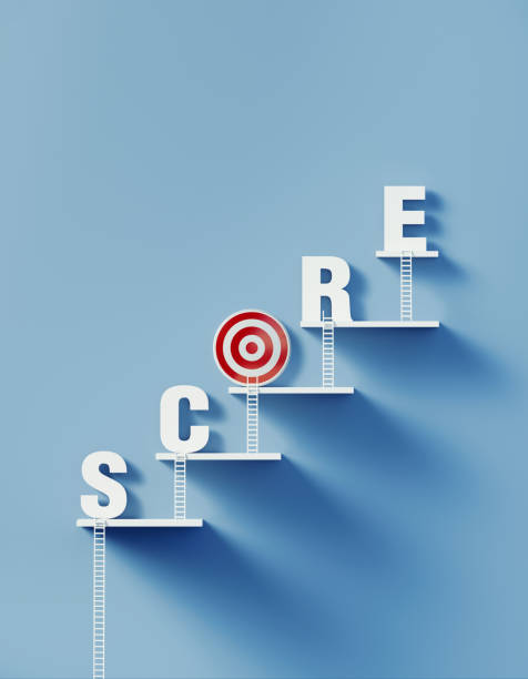 istock White Ladders Lean over A Bull's Eye Target and Write Score on Blue Wall 1292806524