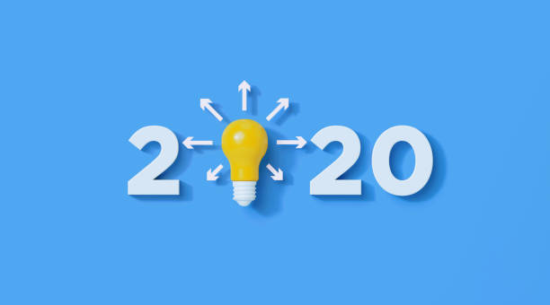 istock White Numbers and Yellow Lightbulb Write 2020 on Blue Background 1292809531