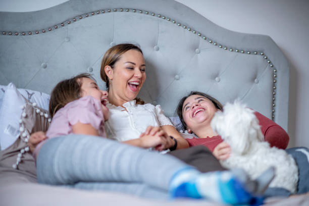 istock Snuggling with mum in bed after work 1292813185