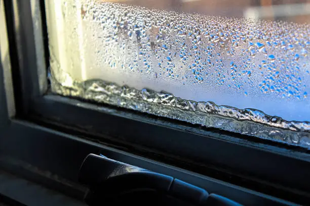 Ice and condensation forming on a window.
