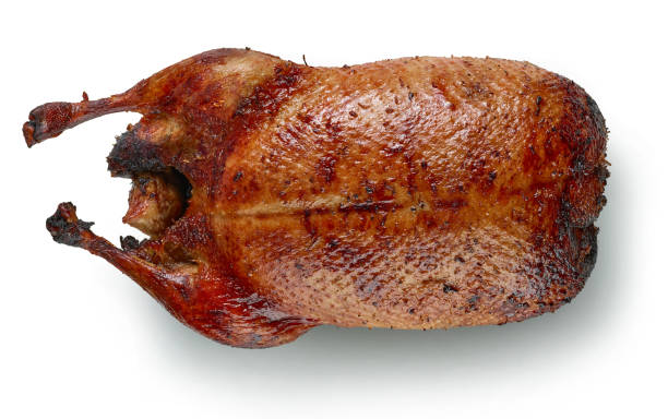 istock freshly roasted duck roast isolated on white background 1292814901