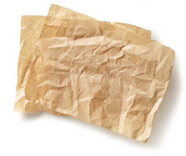 istock crumpled brown baking paper sheets isolated on white background, top view 1292815030